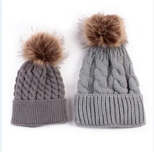 Matching winter pom pom hats